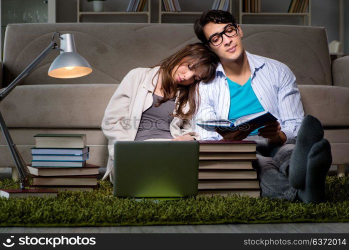 Two students studying late preparing for exams