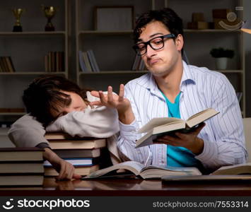 Two students studying late preparing for exams. The two students studying late preparing for exams