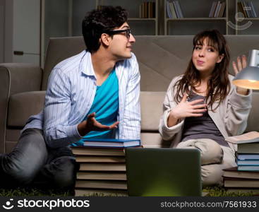 Two students studying late preparing for exams. The two students studying late preparing for exams