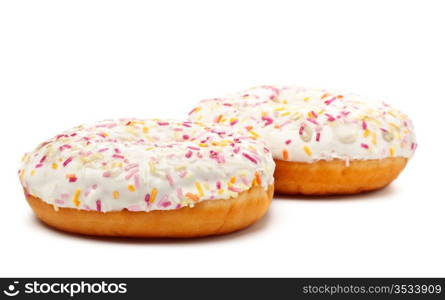 two sugar glazed donuts covered in sprinkles isolated on white