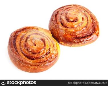 two sweet buns with cinnamon isolated on white