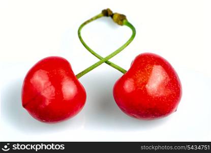 Two sweet cherries crosswise isolated on white background