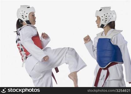 Two taekwondo players fighting