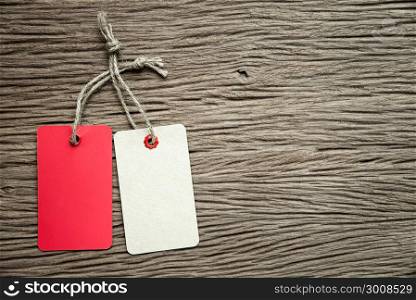 two tags on the wooden background.