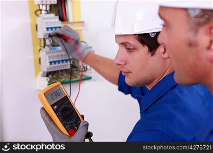Two technical engineers checking electrical equipment