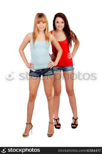 Two teen sisters with jeans shorts isolated on white background