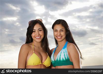 Two teenage girls (16-17) in bikini portrait