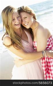 Two Teenage Girls Enjoying Beach Holiday Together