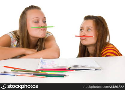 Two teenage girls fool around isolated on white