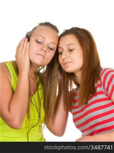 Two teenage girls listening to music on your mobile phone isolated on white