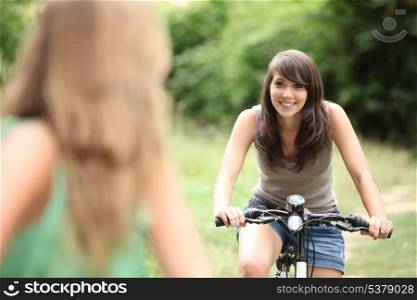 Two teenage girls on bike ride