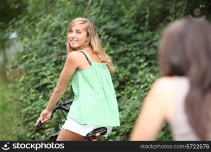 Two teenage girls on bike ride