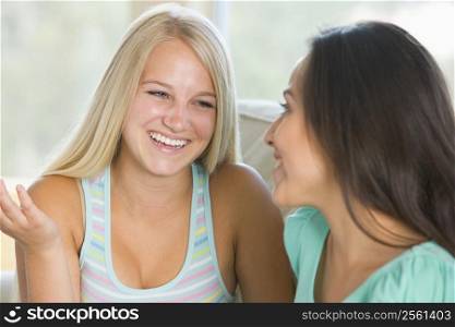 Two Teenage Girls Smiling To Each Other