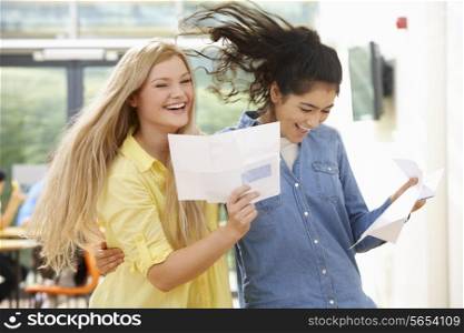 Two Teenage Pupils Celebrating Successful Exam Result
