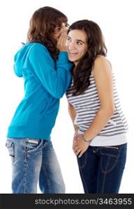 Two teenager girls whispering a secret to the ear