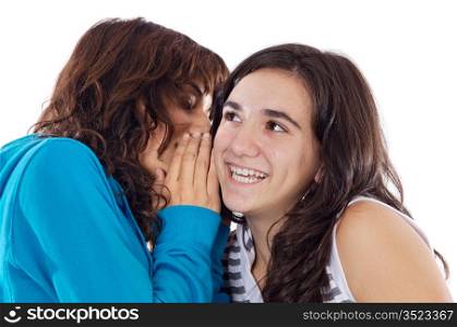 Two teenager girls whispering a secret to the ear