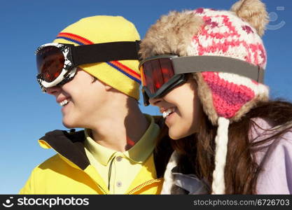 Two Teenagers On Ski Holiday In Mountains