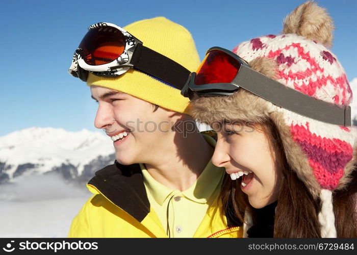 Two Teenagers On Ski Holiday In Mountains