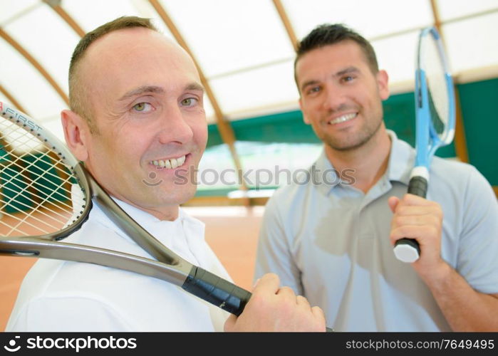 two tennis players having a quick time break