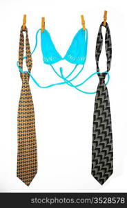 Two Ties And Bra Hanging On a Rope With Wooden Pegs