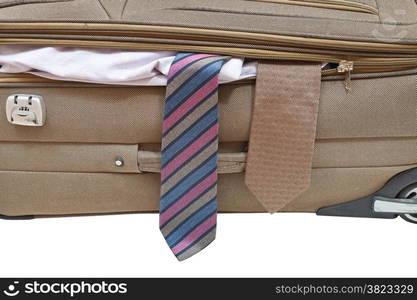 two ties from ajar suitcase isolated on white background