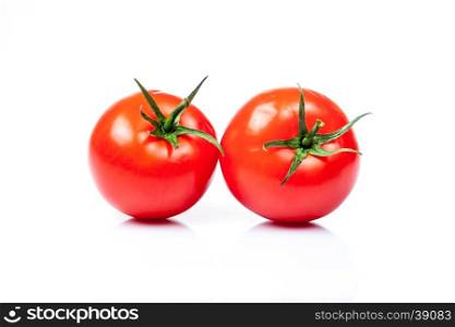 Two tomatoes isolated on a white background