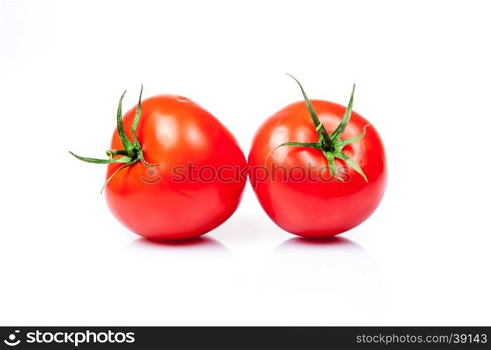 Two tomatoes isolated on a white background