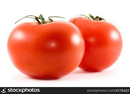 two tomatoes isolated on white