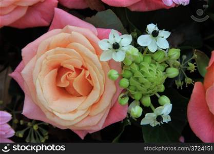 Two toned pink roses and pink gerberas in a bridal flower arrangement