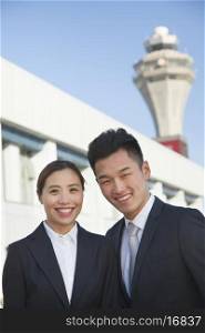 Two travelers portrait at airport