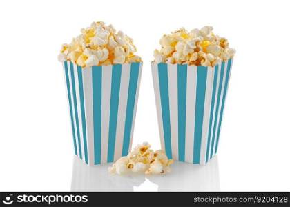 Two turquoise white striped carton buckets with tasty cheese popcorn, isolated on white background. Box with scattering of popcorn grains. Movies, cinema and entertainment concept.