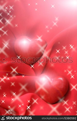 Two valentine hearts on red textile. Valentine&rsquo;s day concept