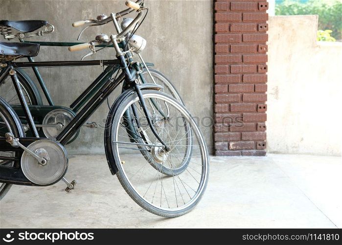 two vintage bicycle parked in front of house