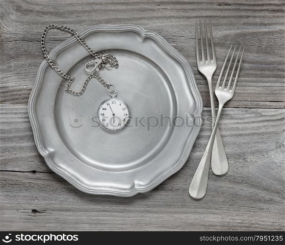 Two vintage fork on a pewter plate