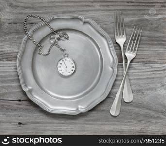 Two vintage fork on a pewter plate