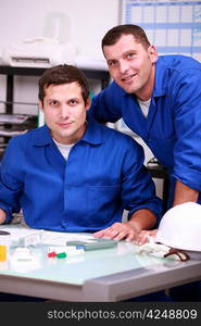 Two warehouse workers taking inventory