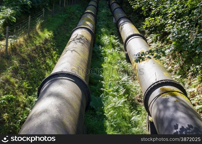 Two water pipes. The pipeline carries water from Coedty reservoir the Dolgarrog hydro electric power station