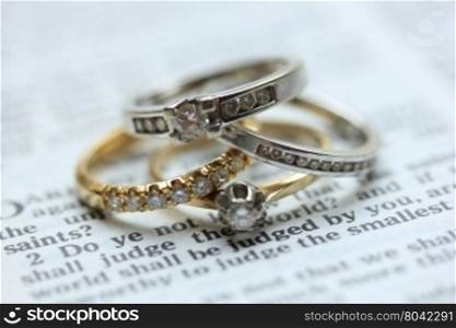 Two wedding sets, one in yellow gold, one in white gold for a double bride wedding on a bible verse