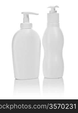 two white cosmetical bottles isolated