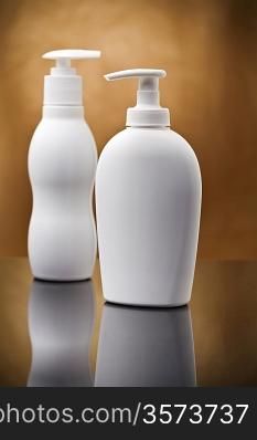 two white cosmetical sprays
