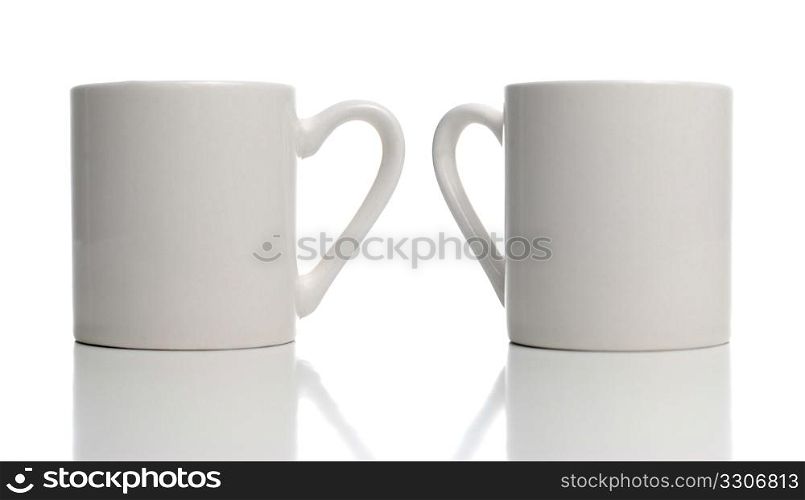 Two white cup on white background with shadow reflection.