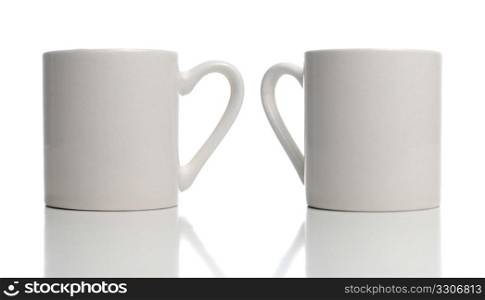 Two white cup on white background with shadow reflection.