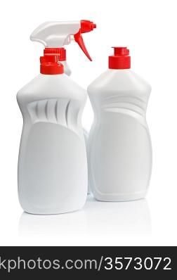 two white kitchen bottles and white spray with red handle
