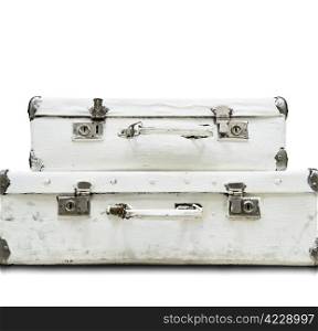 Two white old suitcase isolated from background