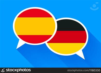 Two white speech bubbles with Spain and German flags. English language conceptual illustration. Two white speech bubbles with Spain and German flags.