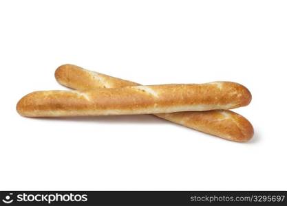 Two whole French bread, baguettes on white background