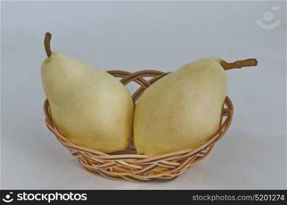 Two whole pear fruits in small basket, Sofia, Bulgaria