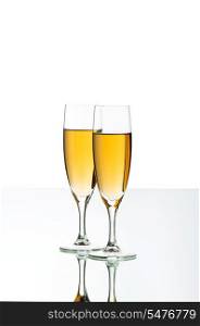 Two wine glasses on the reflective background
