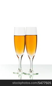 Two wine glasses on the reflective background