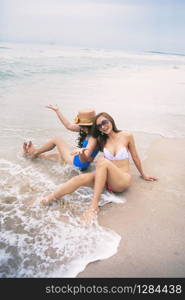 two woman happiness on vacation beach